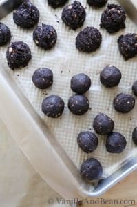 Bon bons in a baking pan lined with parchment paper.