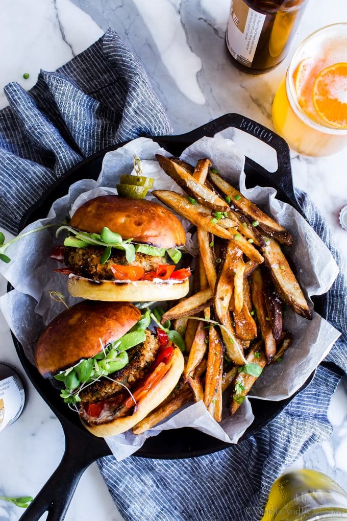 Tow Sweet Potato Burgers with french fries served in a skillet, ready for sharing. 