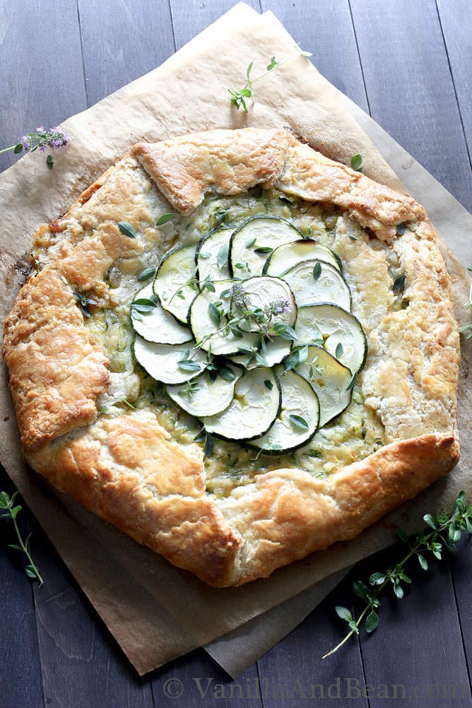 Zucchini and Caramelized Onion Galette on parchment paper