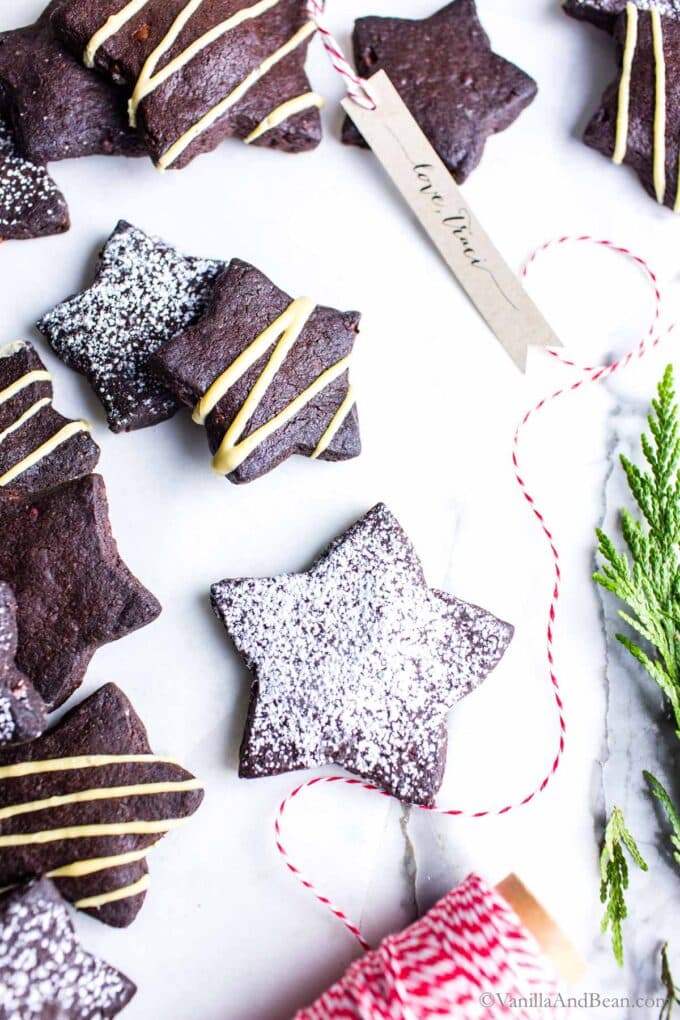 Chocolate shortbread cookies cut into stars and decorated.