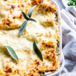 Butternut Squash Lasagna in a baking pan topped with fresh sage.
