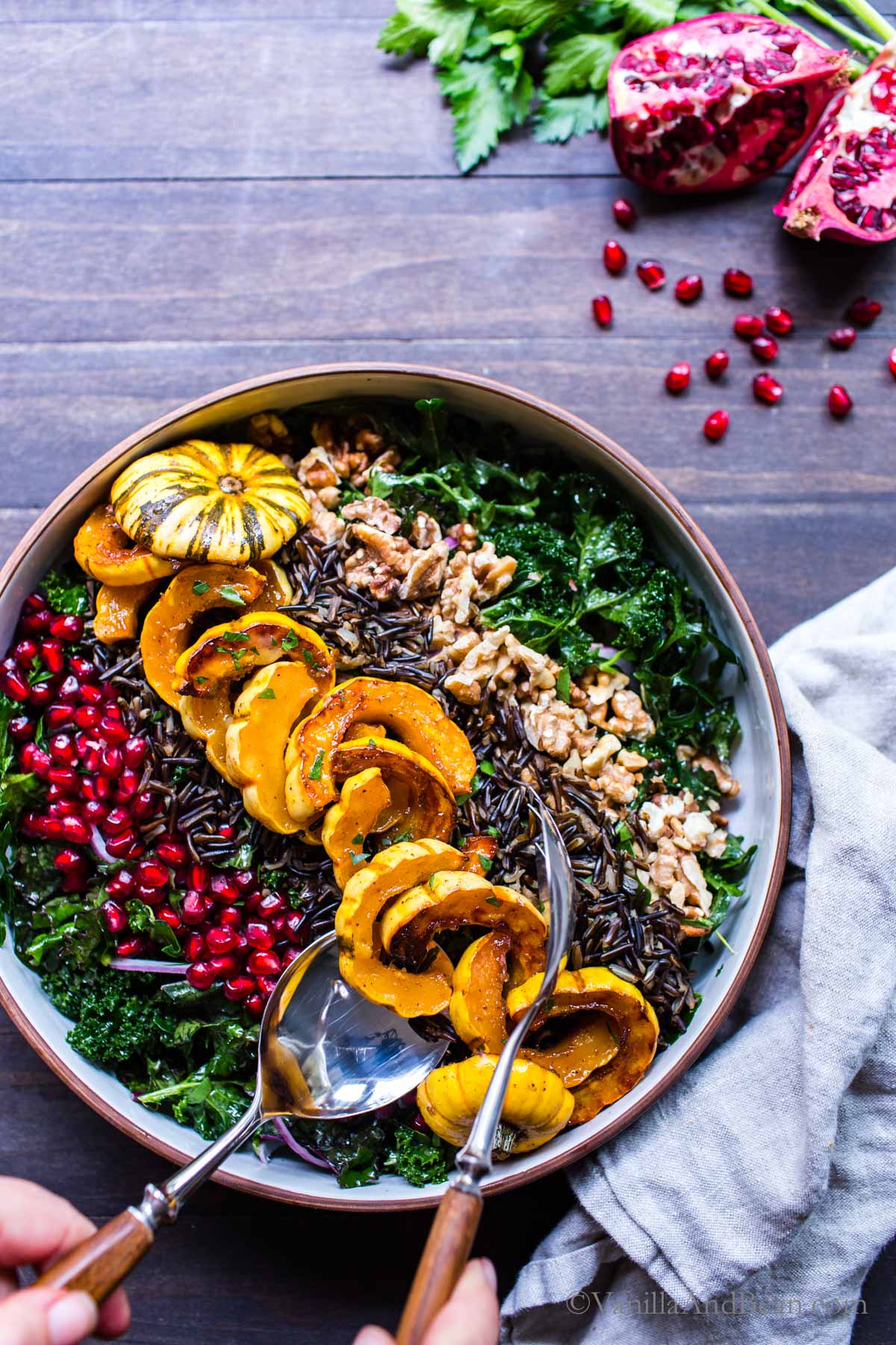 Kale Pomegranate Winter Squash Salad with Wild Rice in a bowl ready to eat. 