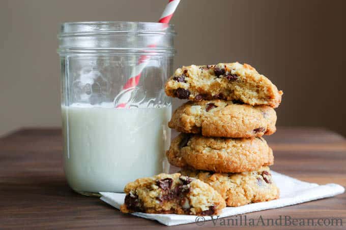 Coconut Macadamia Nut Chocolate Chip Cookies stacked and served with milk