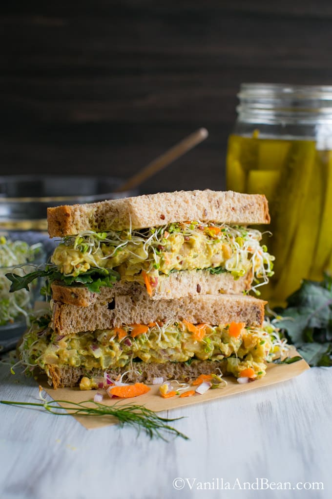 Smashed Chickpea Salad Sandwich cut in half and stacked.