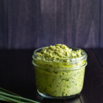 Vegan garlic scape pesto in a short Mason jar.