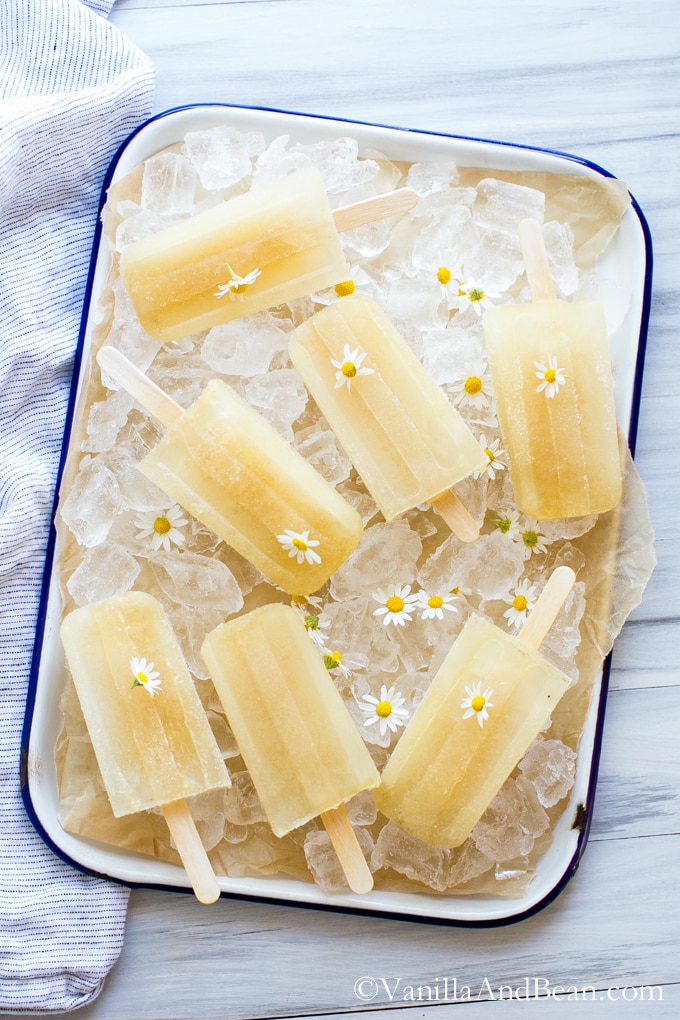 Honey Chamomile Popsicles served on a tray with some ice.