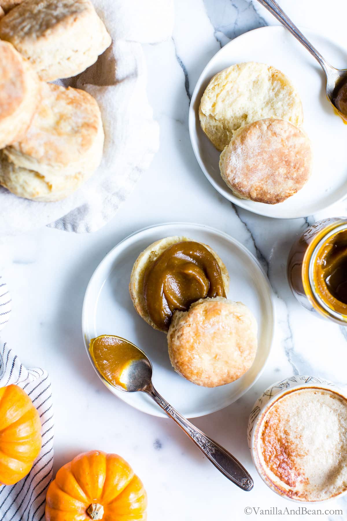 Delicious Homemade Pumpkin Butter recipe with lots of biscuits on the table