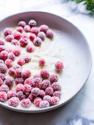 Sugar coated cranberries in a bowl.