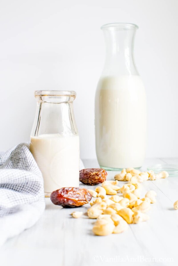 Two bottles of homemade cashew milk.
