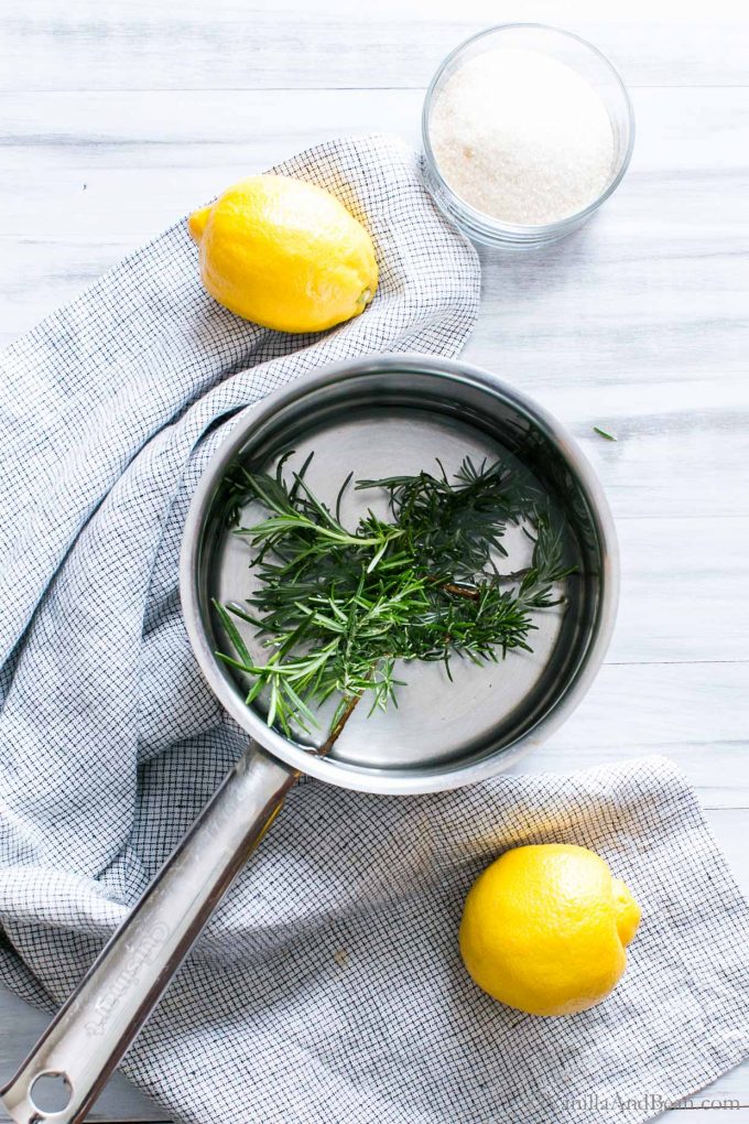 Rosemary simple syrup in a pan.
