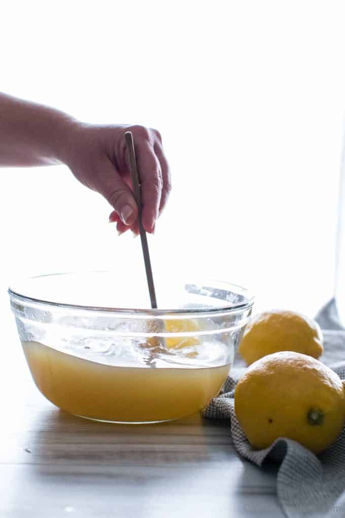 Stirring the lemon juice and sugar.
