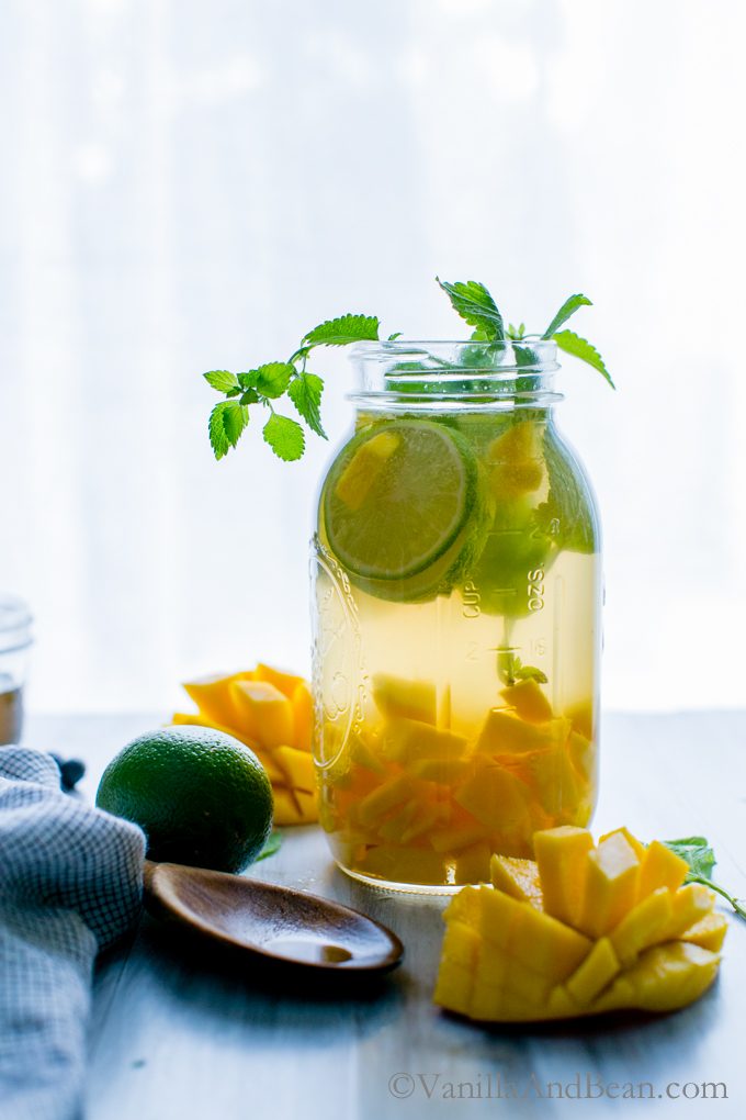 Mango Sangria in a Mason jar with lime and mint. 