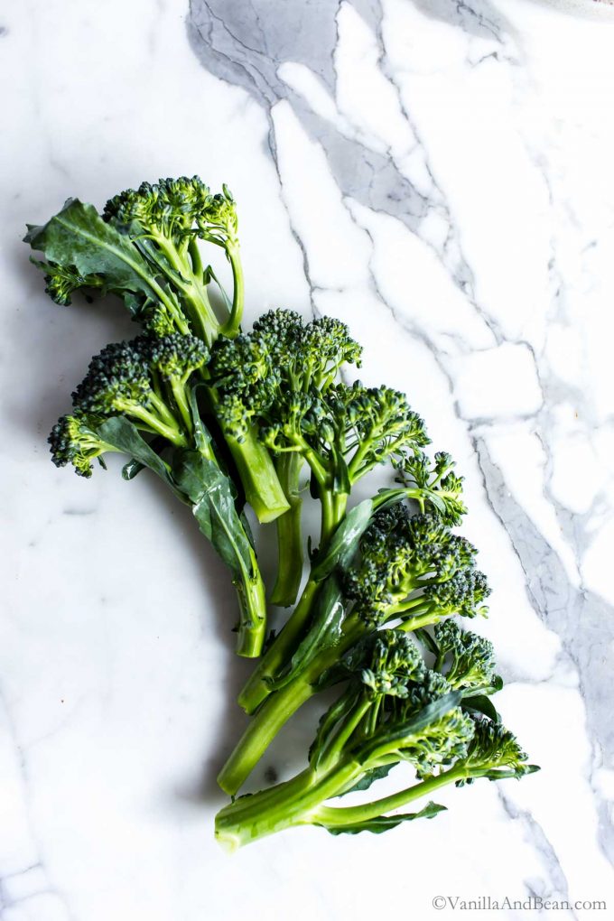 Broccolini on a marble table.