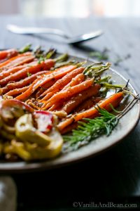 Maple-Roasted Cardamom-Spiced Carrots and Apples on a serving platter.