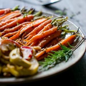 Maple-Roasted Cardamom-Spiced Carrots and Apples on a serving platter.