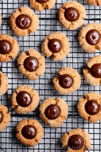 A tender and moist peanut butter cookie with an irresistible chocolate ganache center. Vegan Peanut Butter Kisses are easy to make, and fun to share! Vegan, Dairy Free, Egg Free, Recipe.