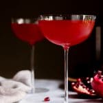 A pear and orange liquor, pomegranate and orange juice cocktail. Winter Punch. | Recipe, Holiday, Drink