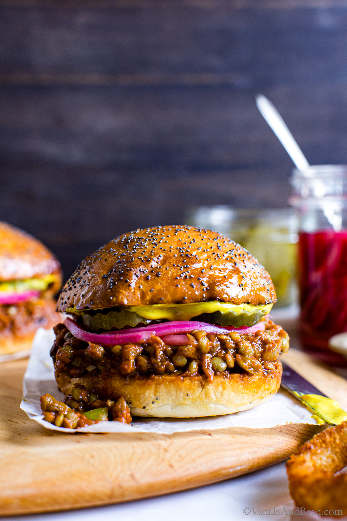 Veggie sloppy joe sandwich on a wood board.