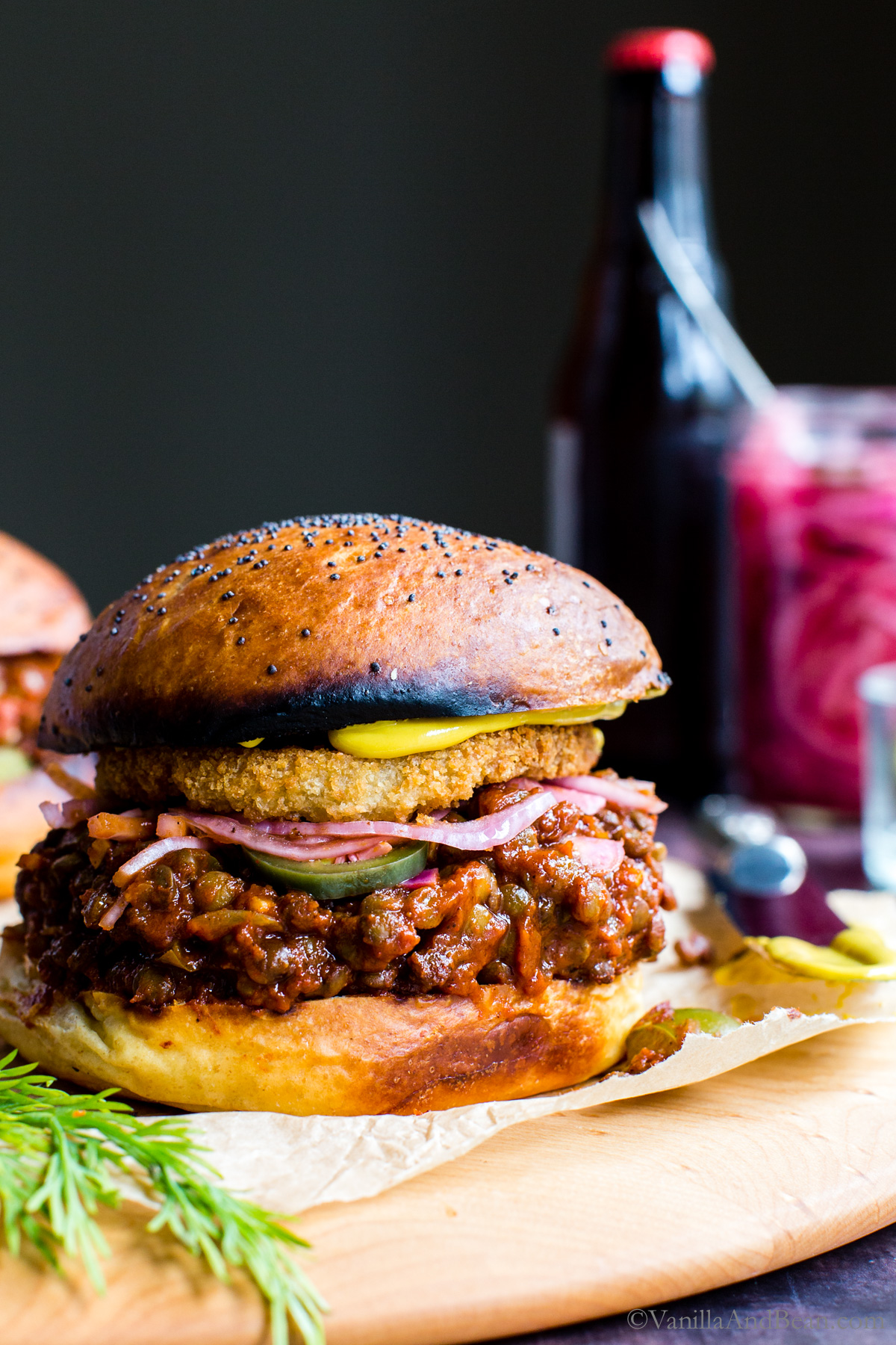 Veggie sloppy joe sandwich on a wood board.