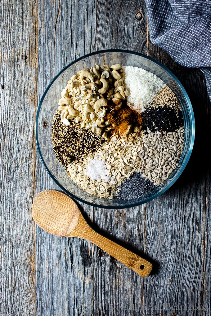 A bowl of ingredients for Lemon Tahini Cashew Granola ready to mix
