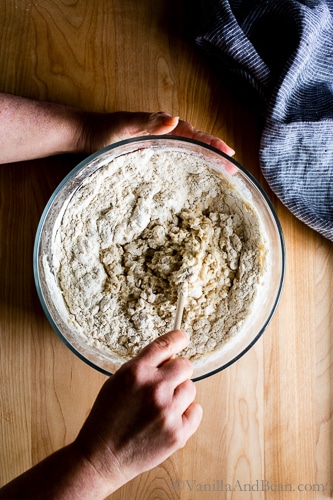 Mixing the bread dough in a bowl. 