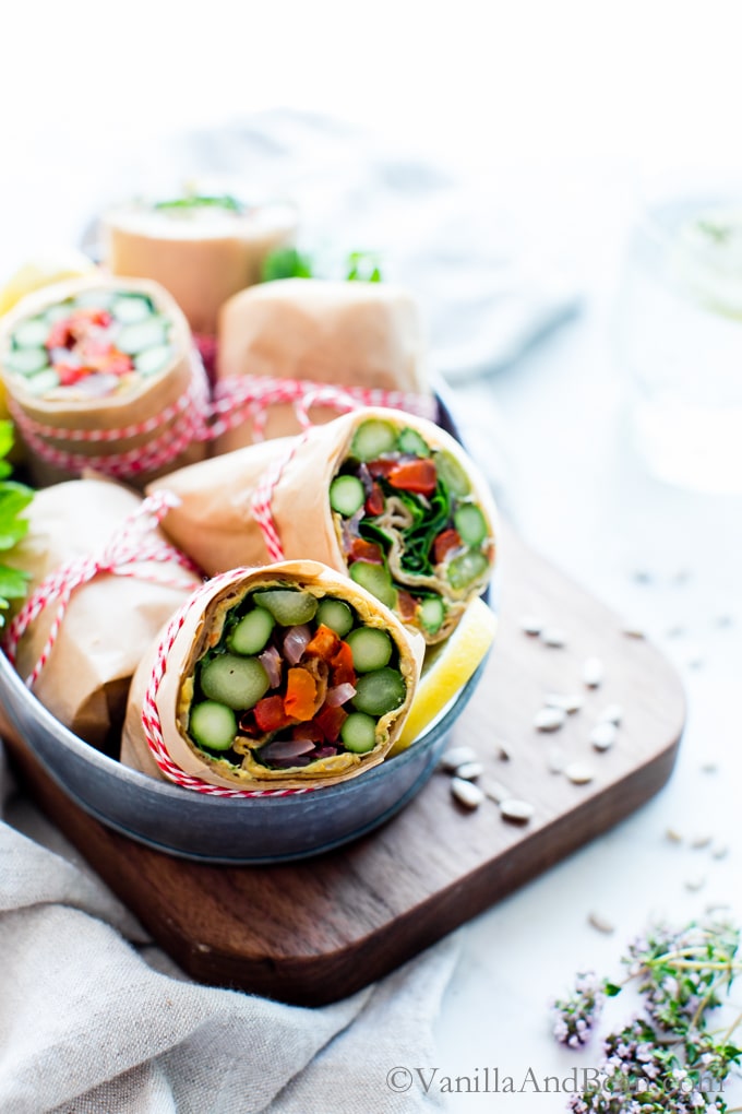 Asparagus Wraps with Whipped Avocado Sun-Dried Tomato Spread in a serving tin. 