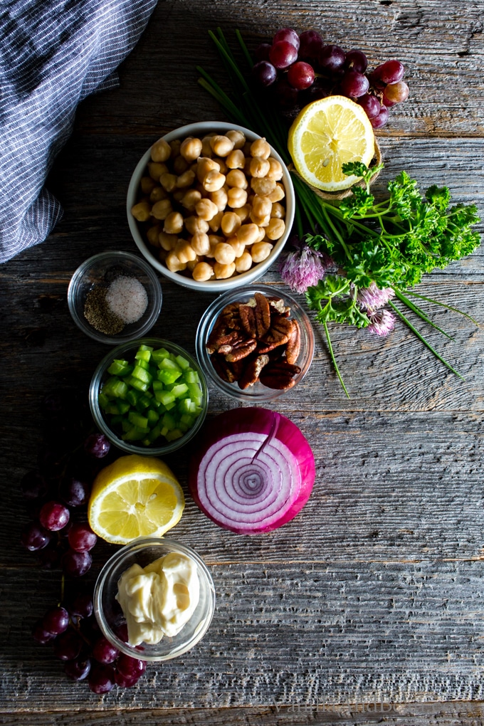 Overhead shot of Smashed Chickpea Salad with Pecans and Grapes recipe ingredients.