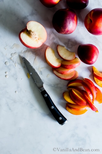 Sliced Nectarines on a marble table. 