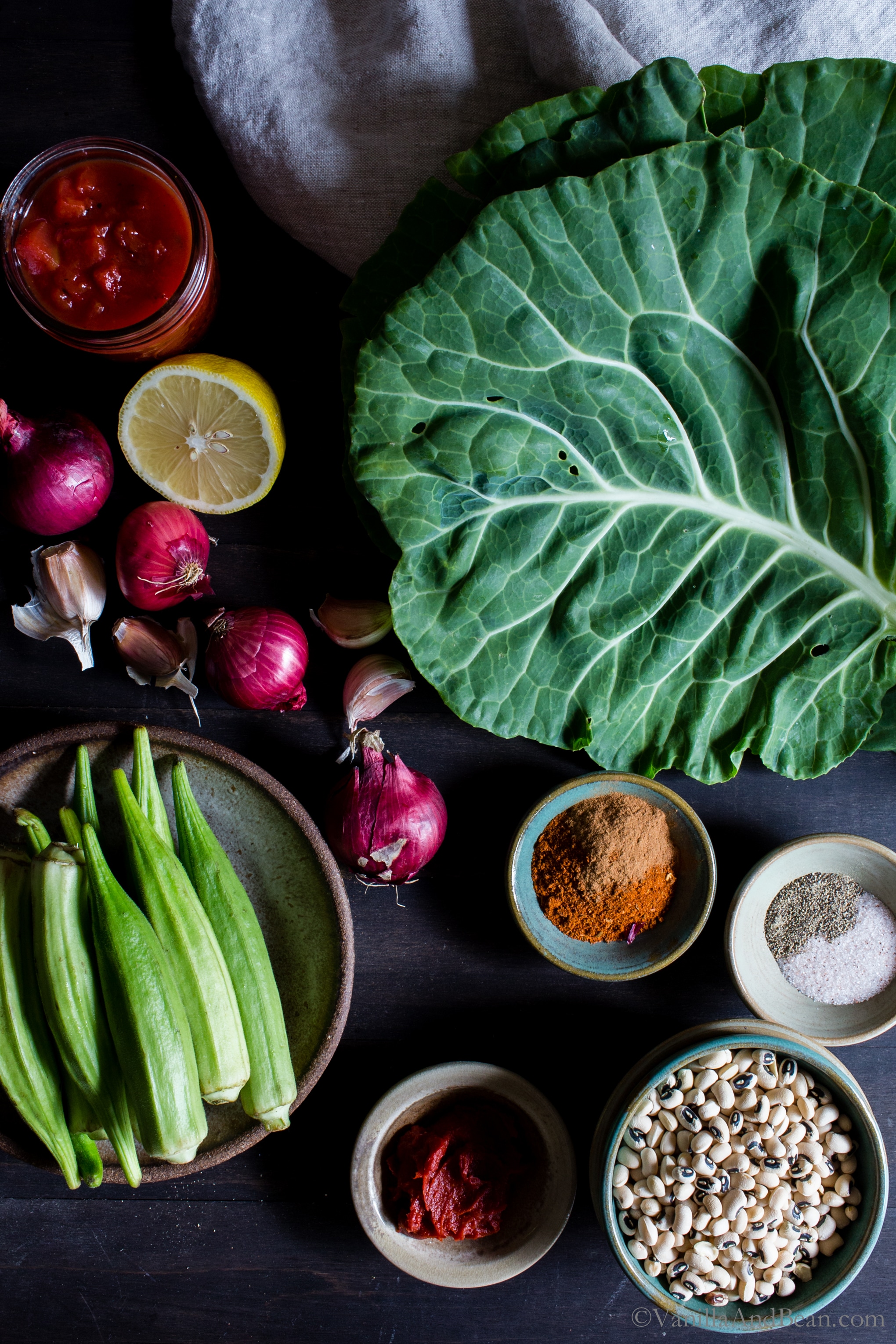 Overhead shot of ingredients for Harissa Stewed Black-Eyed Peas with Okra and Collard Greens.