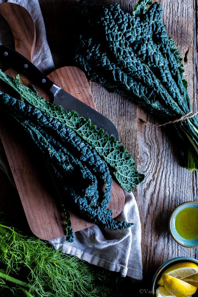 Overhead shot of kale on a cutting board. 