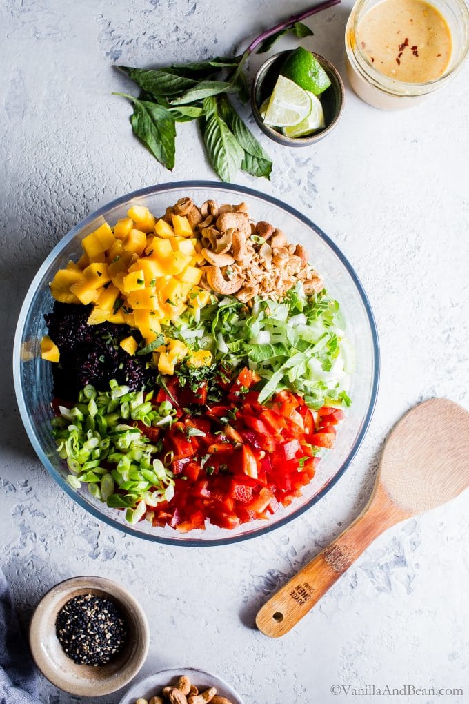 Overhead shot of all the ingredients in a bowl for Forbidden Rice® Salad ready to be mixed. 