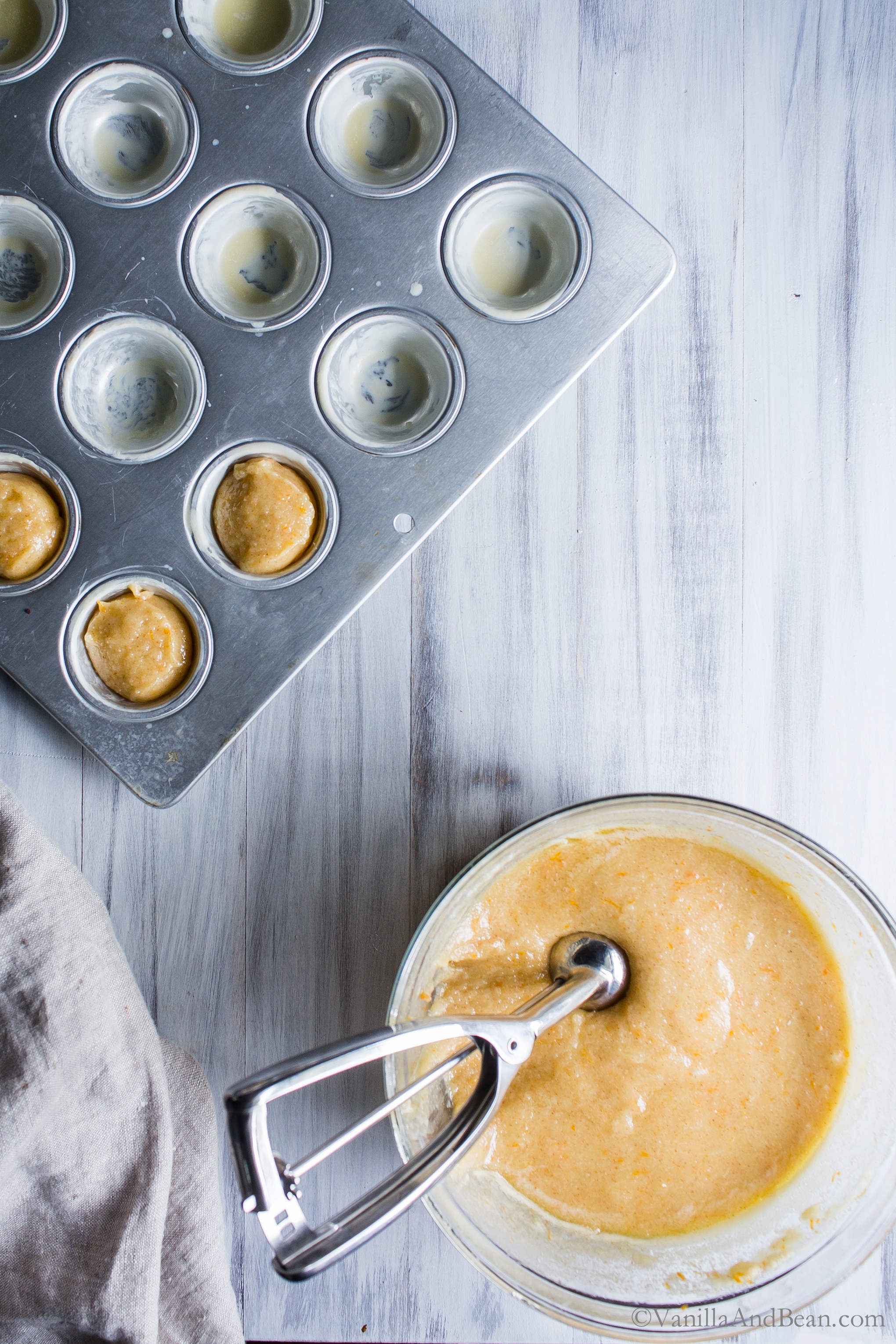 Scooping the batter into mini muffin tins. 