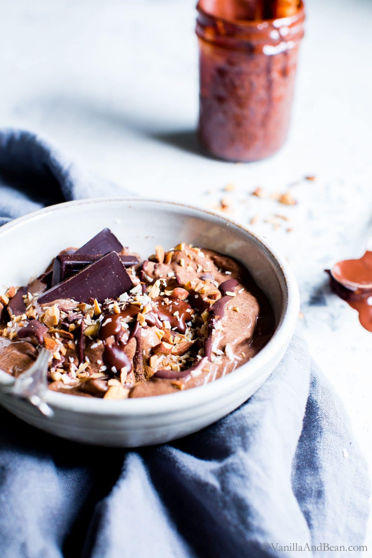 Mexican Chocolate Almond Nice Cream Bowls with a spoon and drizzled with chocolate ready for sharing.