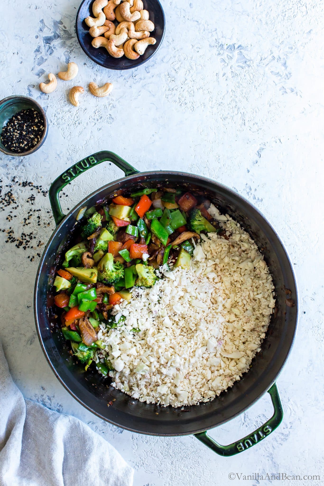 Add the cauliflower rice to the sauted veggies. 