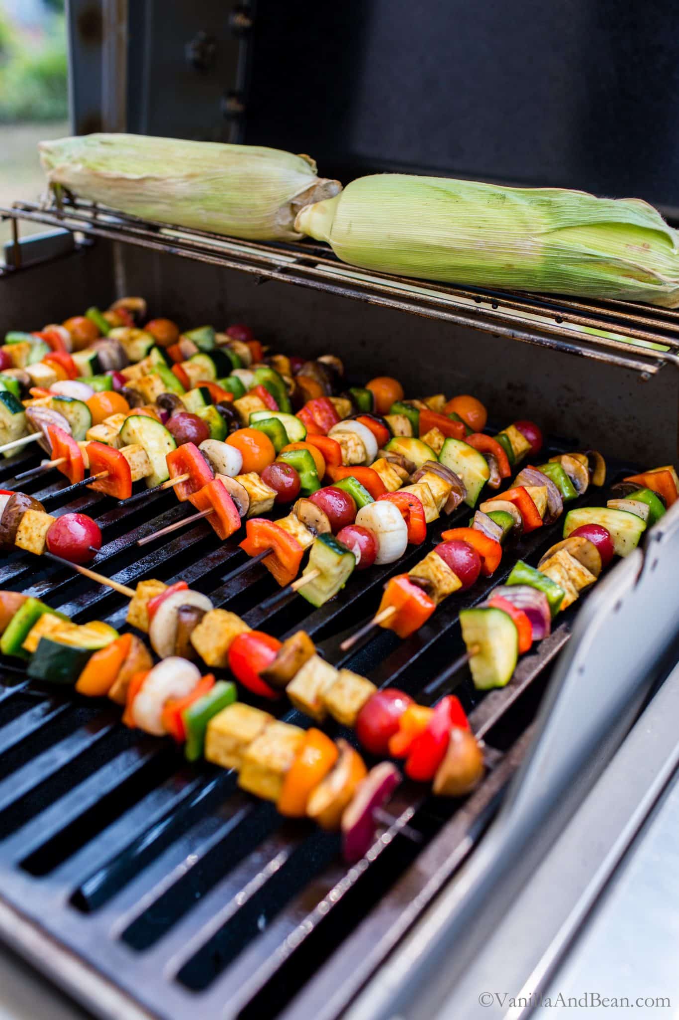  Grilled BBQ Tofu Vegetable Kebabs on the grill with corn. 