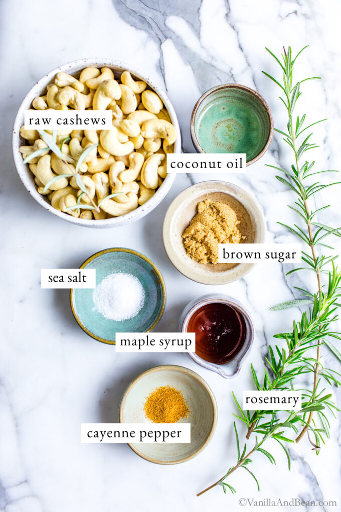 Ingredients for rosemary roasted cashews on a table. 