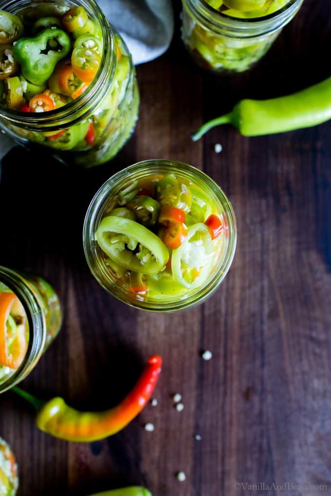 Overhead shot of Pickled Banana Peppers in jars. 