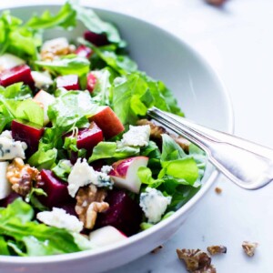 Beet and Apple Salad with Apple Cider Vinaigrette in a serving bowl ready to be shared.