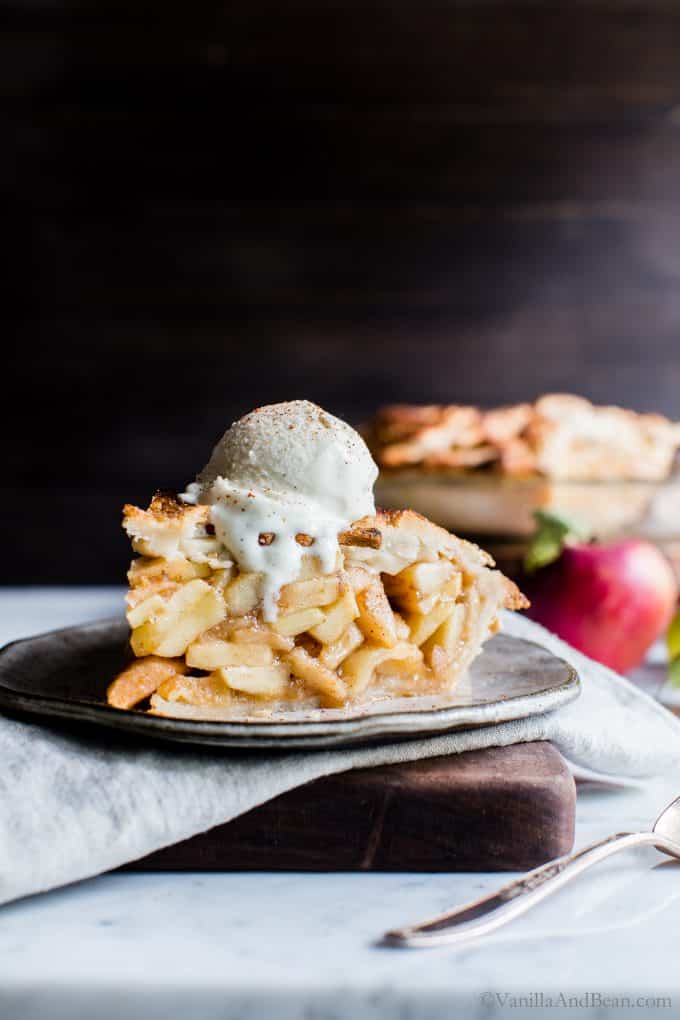Gluten free and vegan Apple Pie slice on a plate ready to be eaten. 