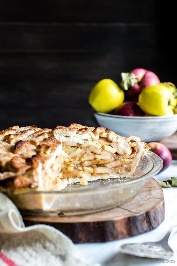 Apple packed, slightly sweet with a hint of bourbon, this Apple Pie is gluten free + vegan, but you'd never know it. A tender-flakey coconut oil pastry with an easy cut out top crust makes this Apple Pie simple to assemble and fun to share. Apple pie for everyone! Hooray! #GlutenFreeApplePie #VeganApplePie #GlutenFreeVeganApplePie