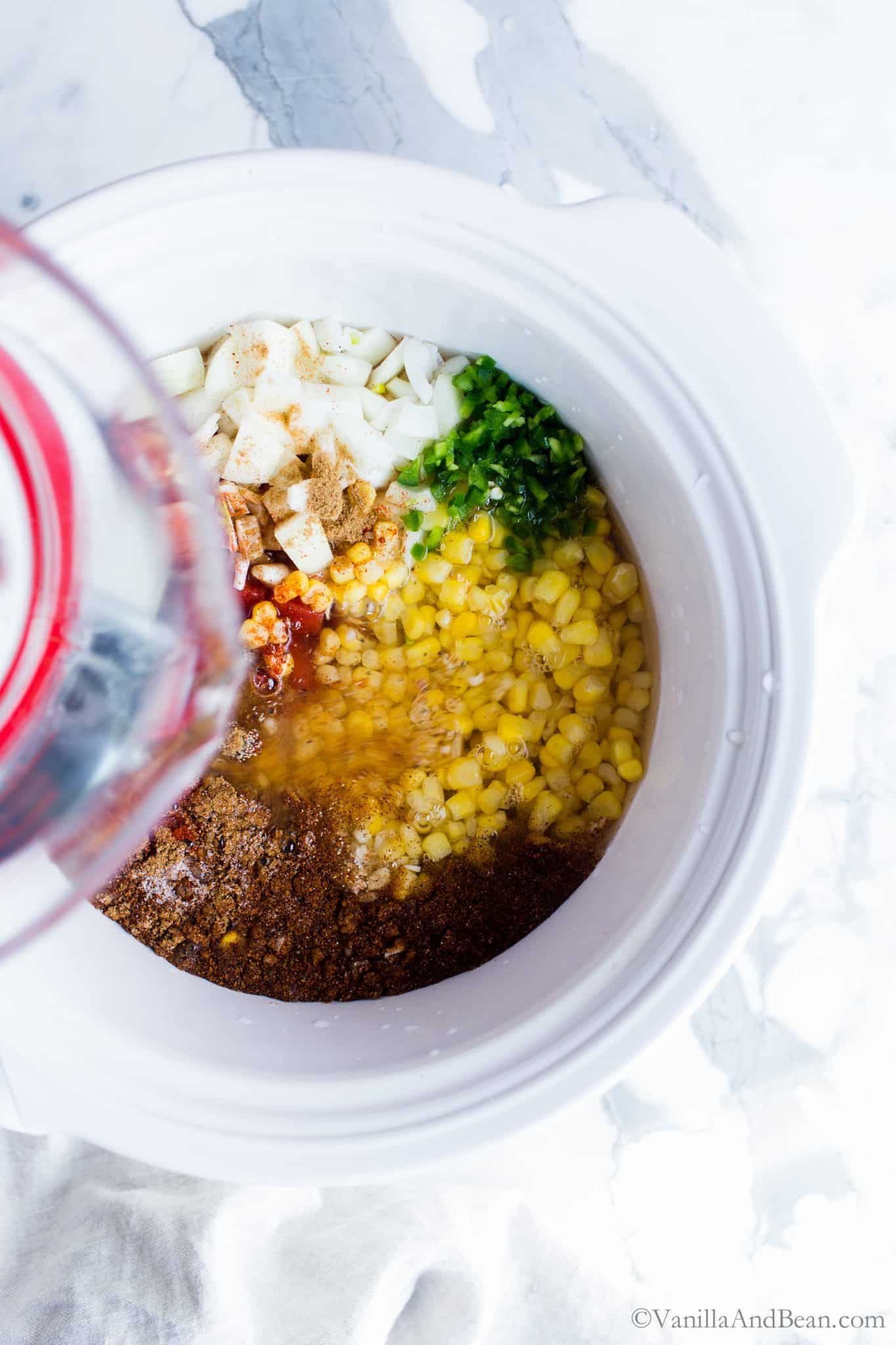 Add the water to the slow cooker. 