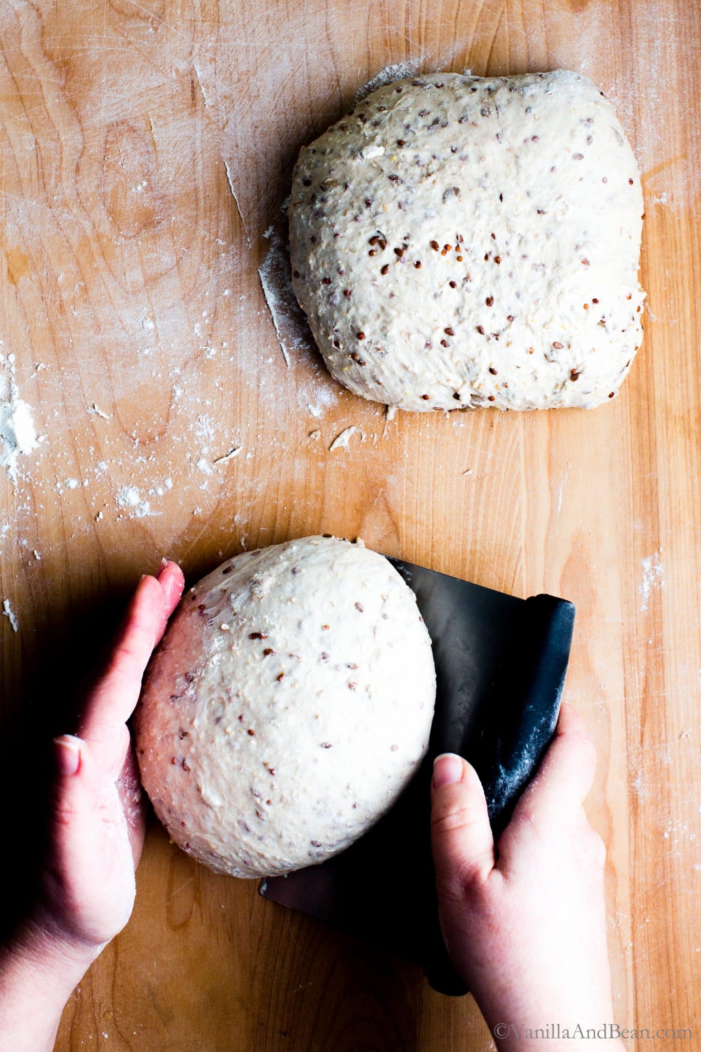 A person shaping a boule of sourdough bread. 