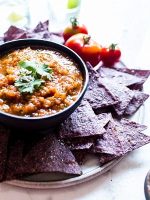 Easy Mexican Chipotle Salsa in a bowl, served with purple chips.