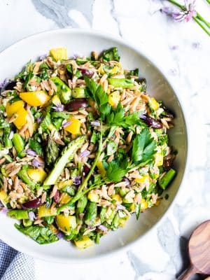 Lemon Orzo Salad with Asparagus, Spinach and Feta in a big bowl ready to be shared.