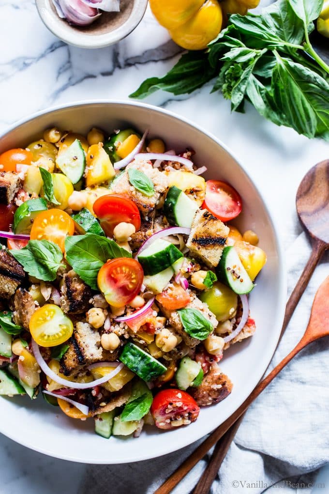 Grilled Panzanella Salad in a large serving bowl with two spoons for sharing.