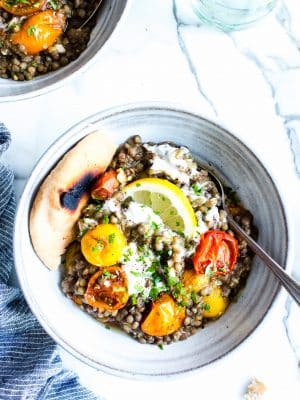 Mediterranean Eggplant with Lentils in a bowl with a spoon.