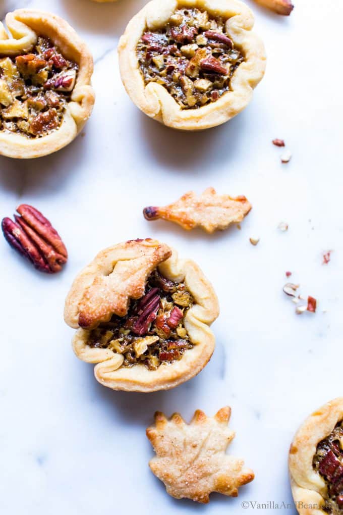Finished Mini Pecan Pies with pastry leaf cutouts. 