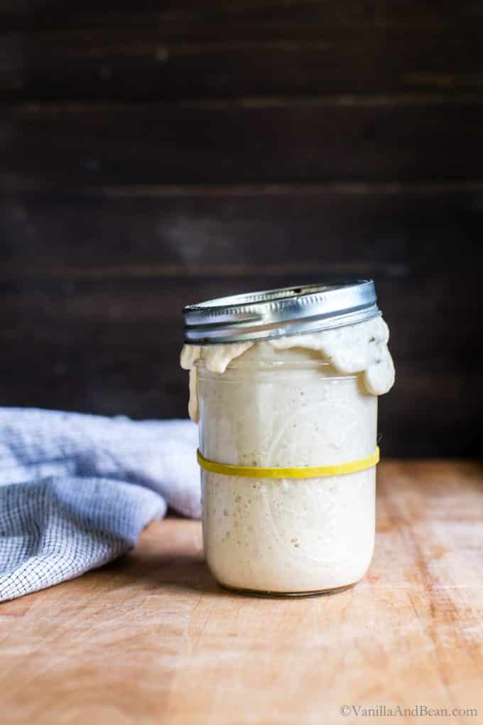 Sourdough starter in a jar, spilling over the top! It's ready to use in a recipe. 