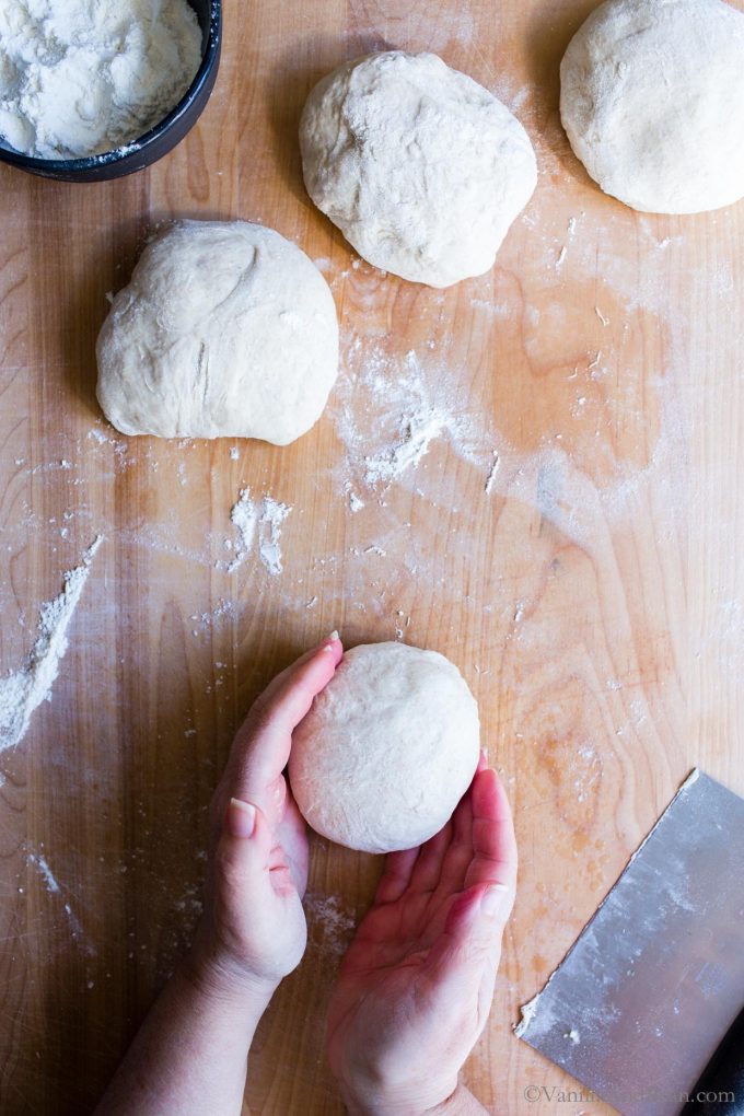 Shaping the sourdough pizza dough.