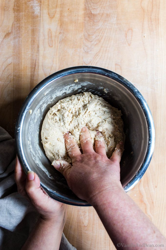 Kneading the soaker oats into the sourdough.
